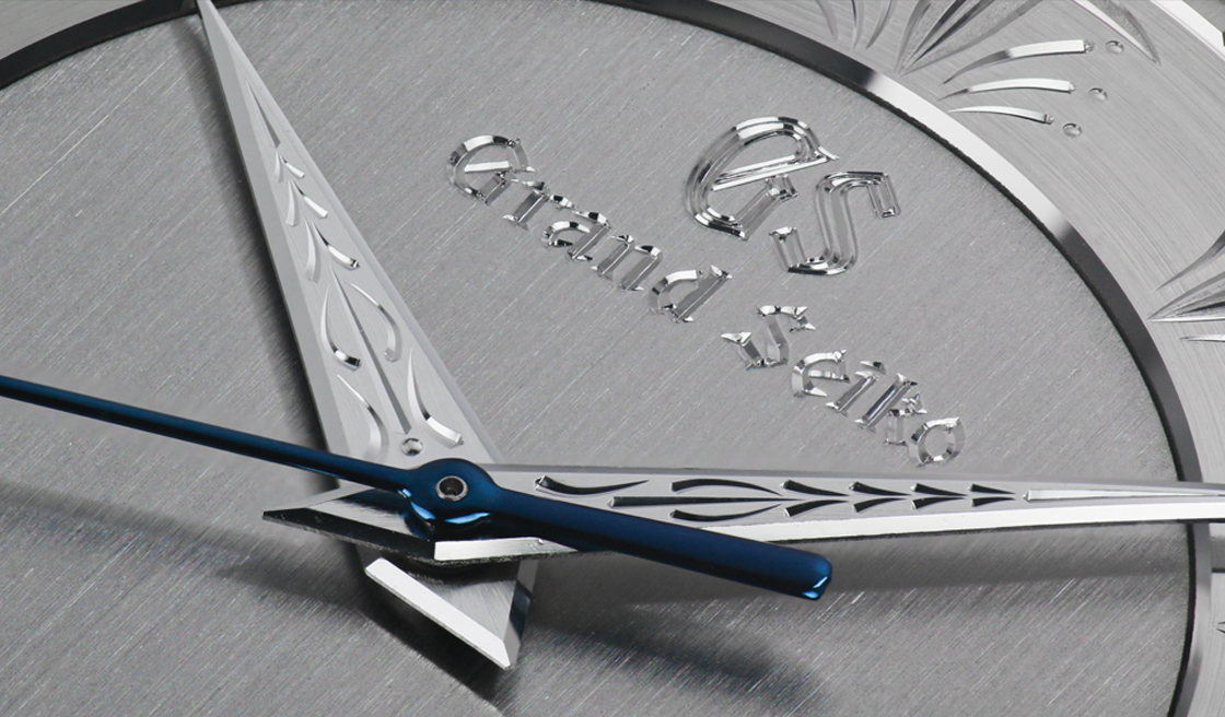 A closeup of the hand engraving work on the dial of Grand Seiko SBGW263.