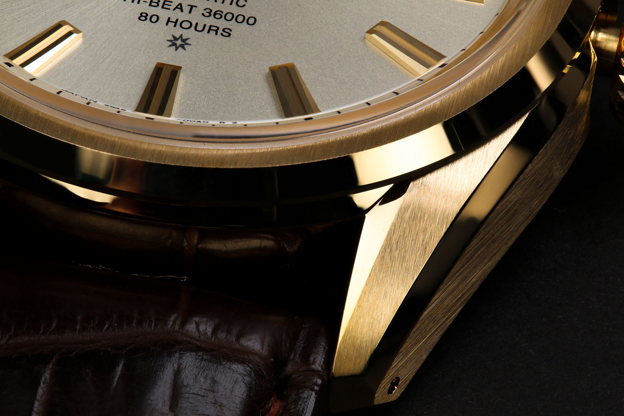 Intricate gold case finishing on Grand Seiko SLGH002.