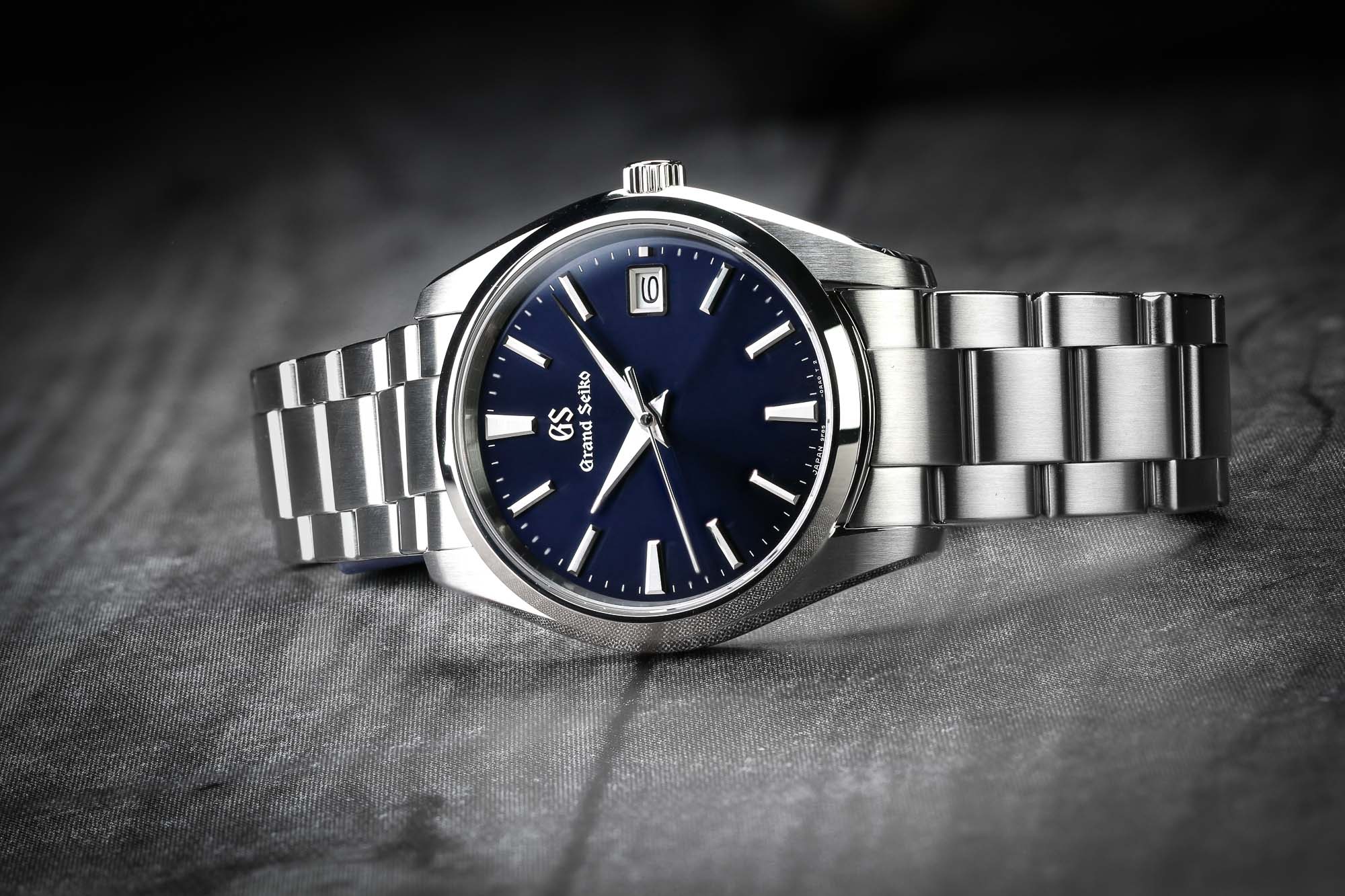 Grand Seiko SBGP013 stainless steel wristwatch with blue dial.