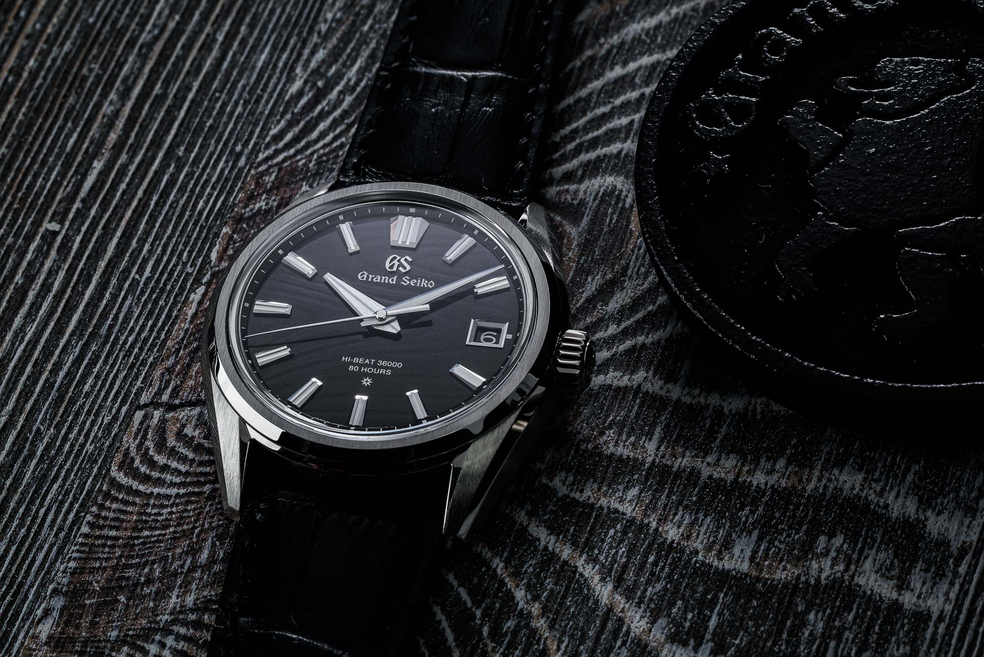 Grand Seiko SLGH007 dark dial stainless steel wristwatch.